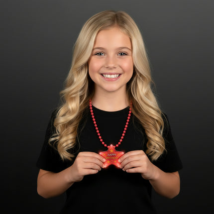 Happy Birthday star flashing necklace worn by a birthday guest