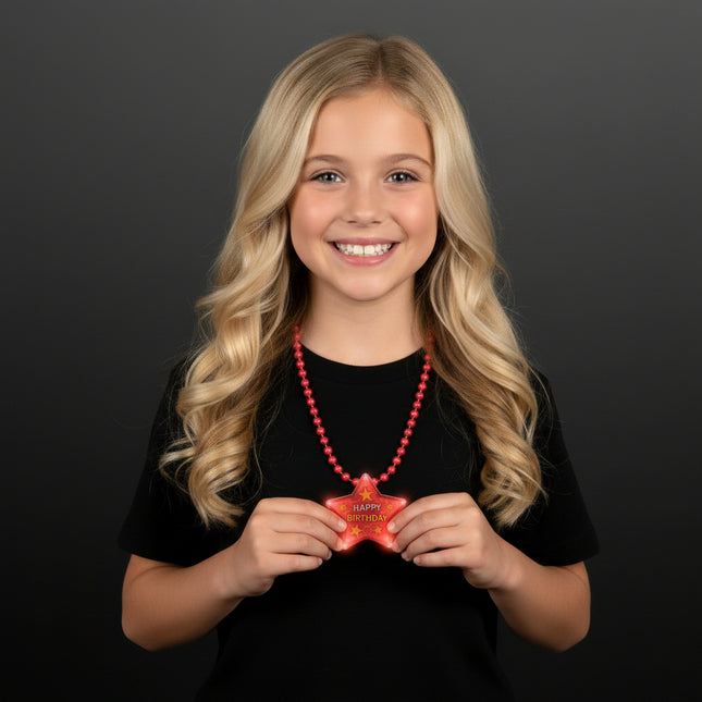 Happy Birthday star flashing necklace worn by a birthday guest