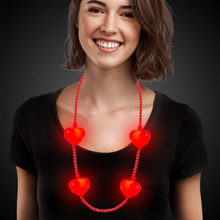 LED red heart necklace on a model 