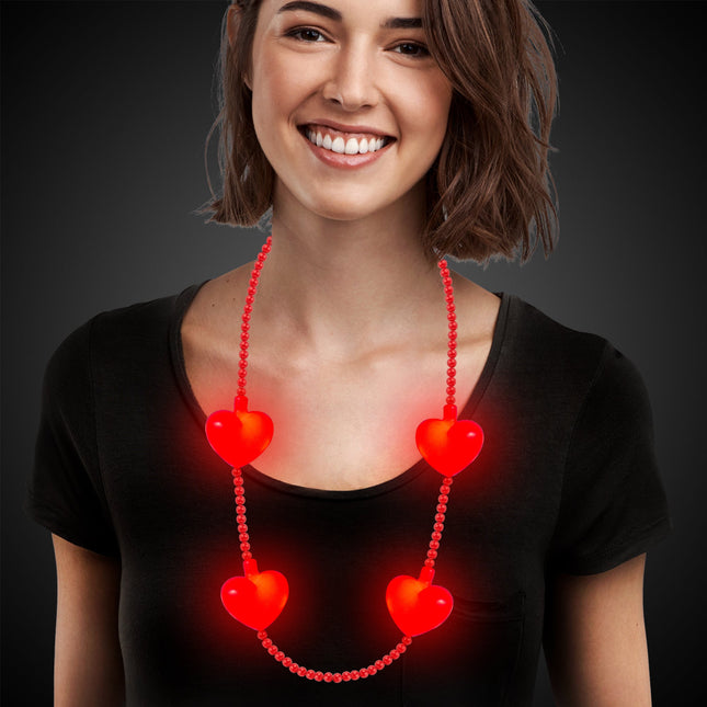 LED red heart necklace on a model 