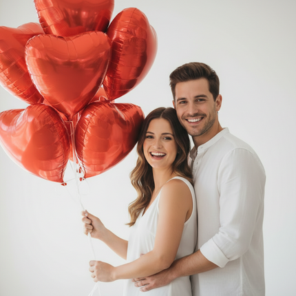 Man and woman embracing with a heart-shaped balloon indoors.