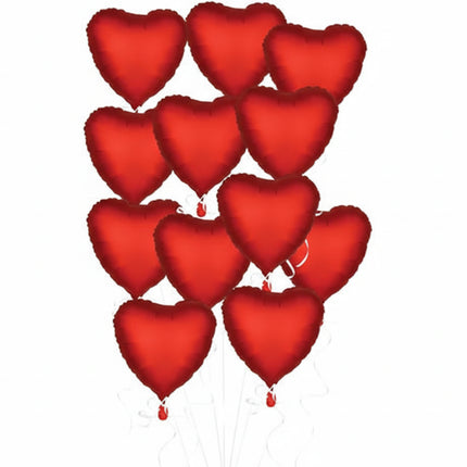 Red heart-shaped balloons on a white background