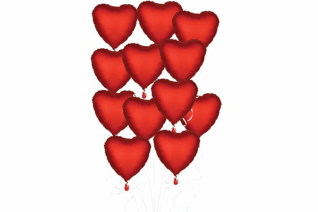 Red heart-shaped balloons on a white background