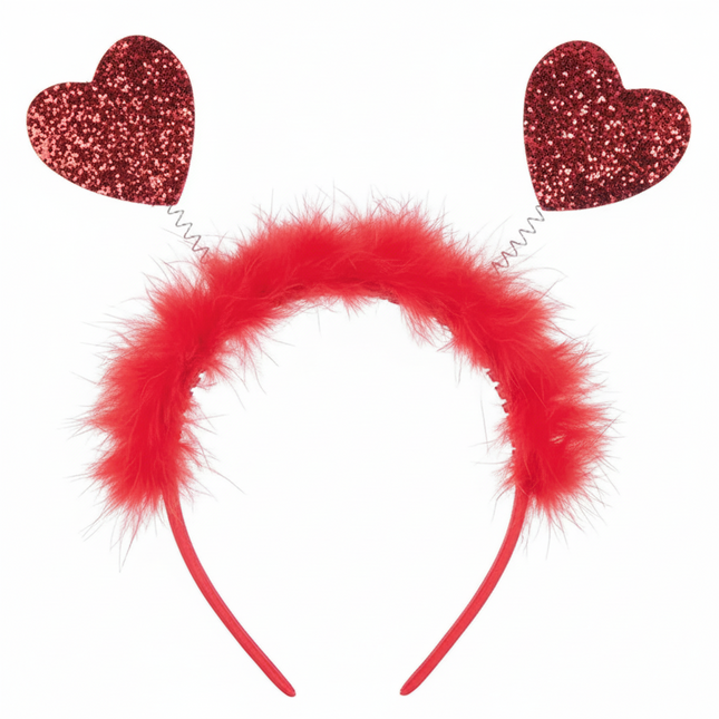 Red heart-shaped headband with fluffy center on a white background